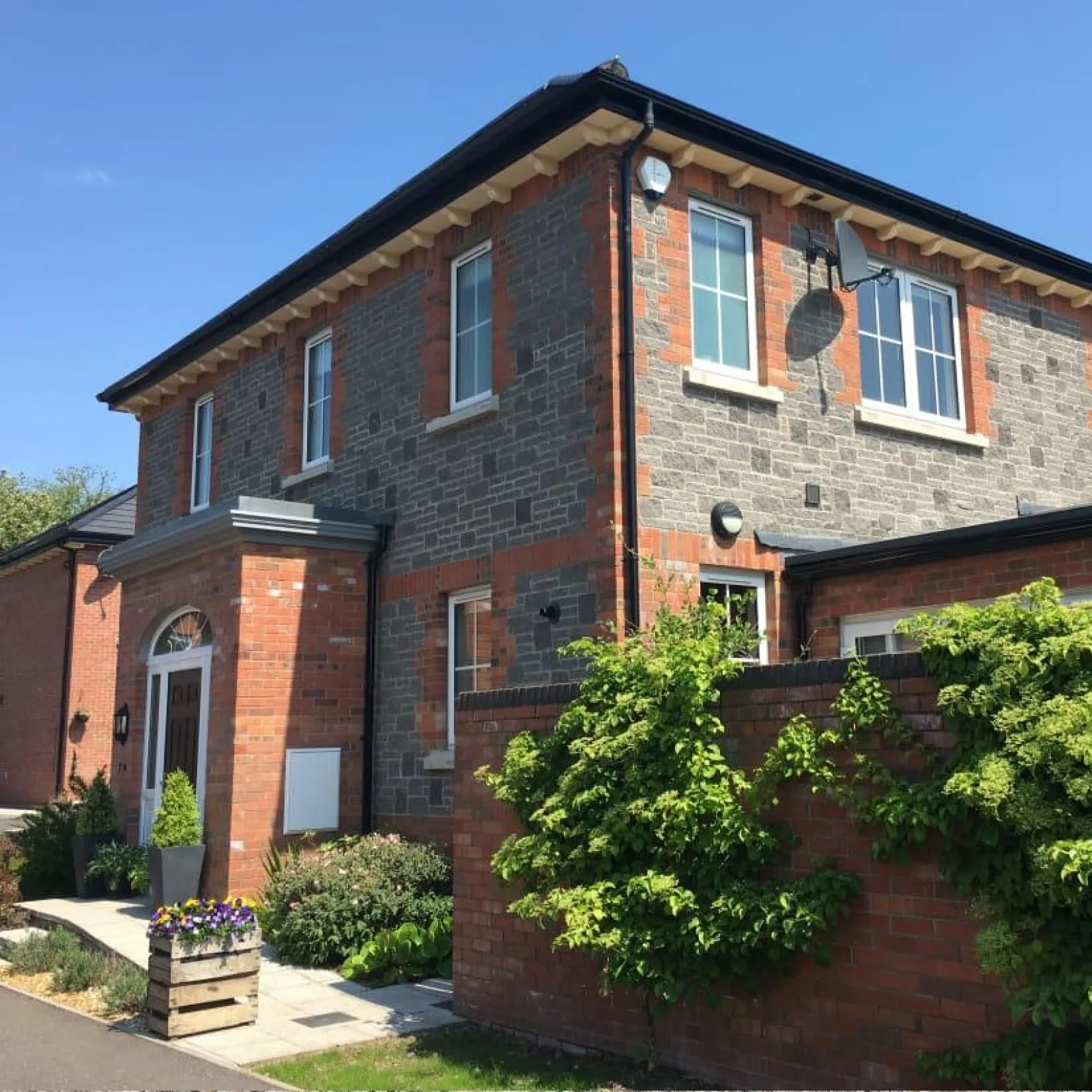 Modern two-storey brick house built with concrete masonry blocks.
